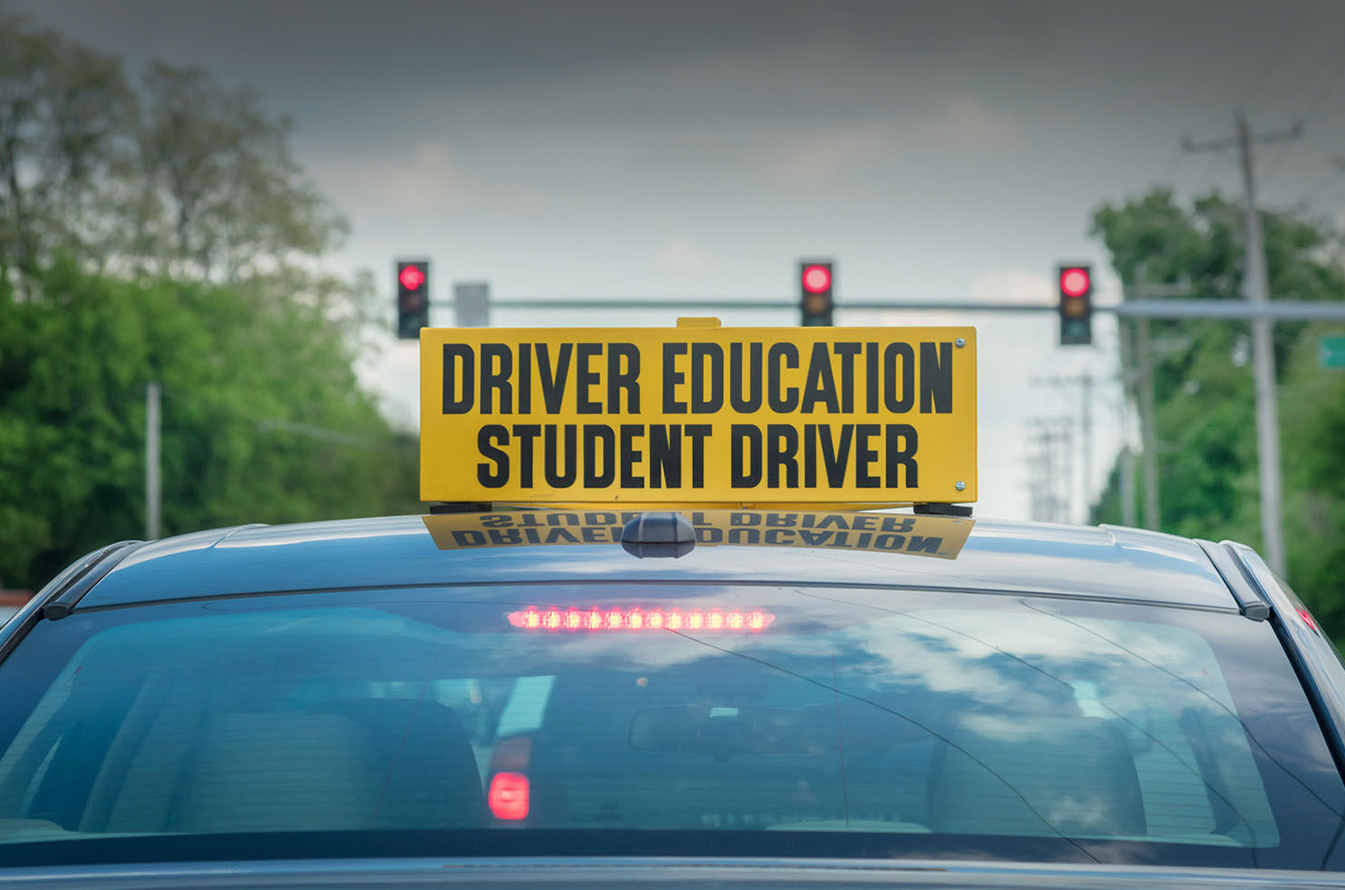 Image of a car with driver's ed sign on top